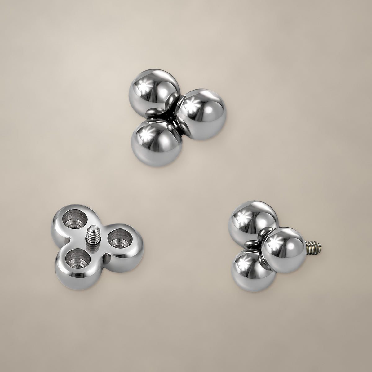 Bead trio internally threaded end in titanium, shown from three angles