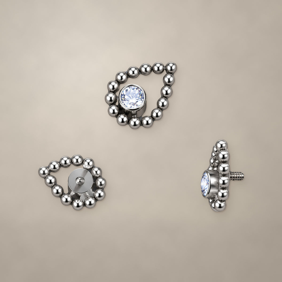 Beaded teardrop internally threaded end in titanium, shown from three angles