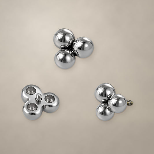 Bead trio internally threaded end in titanium, shown from three angles