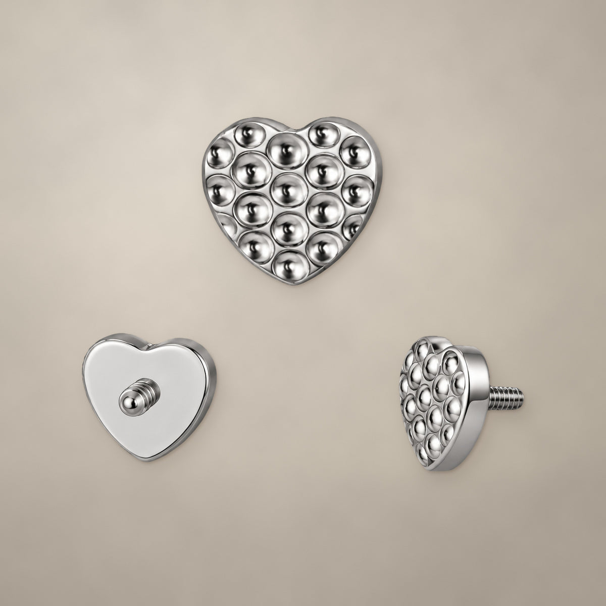Textured heart internally threaded end in titanium, shown from three angles