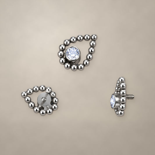 Beaded teardrop internally threaded end in titanium, shown from three angles