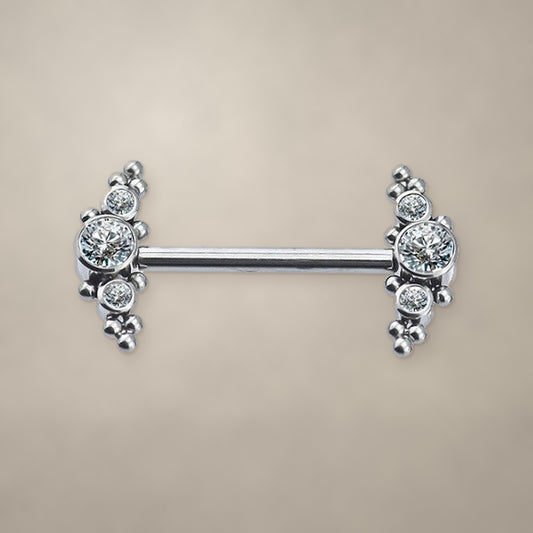 Titanium nipple barbell with round stone and bead clusters on both ends