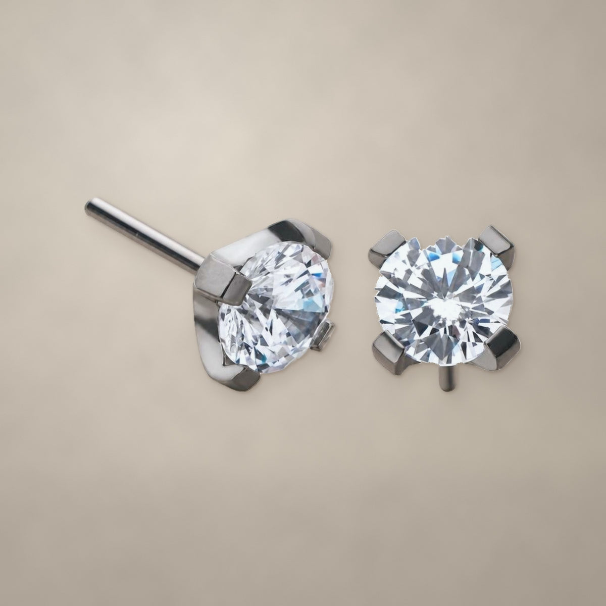 Round prong-set CZ threadless end in titanium, shown from two angles