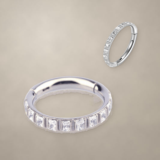 Baguette-set titanium clicker ring, shown from two angles
