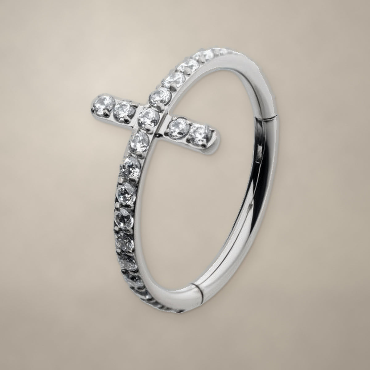 Titanium hinged clicker ring with a clear CZ cross and clear CZ stones set along the band