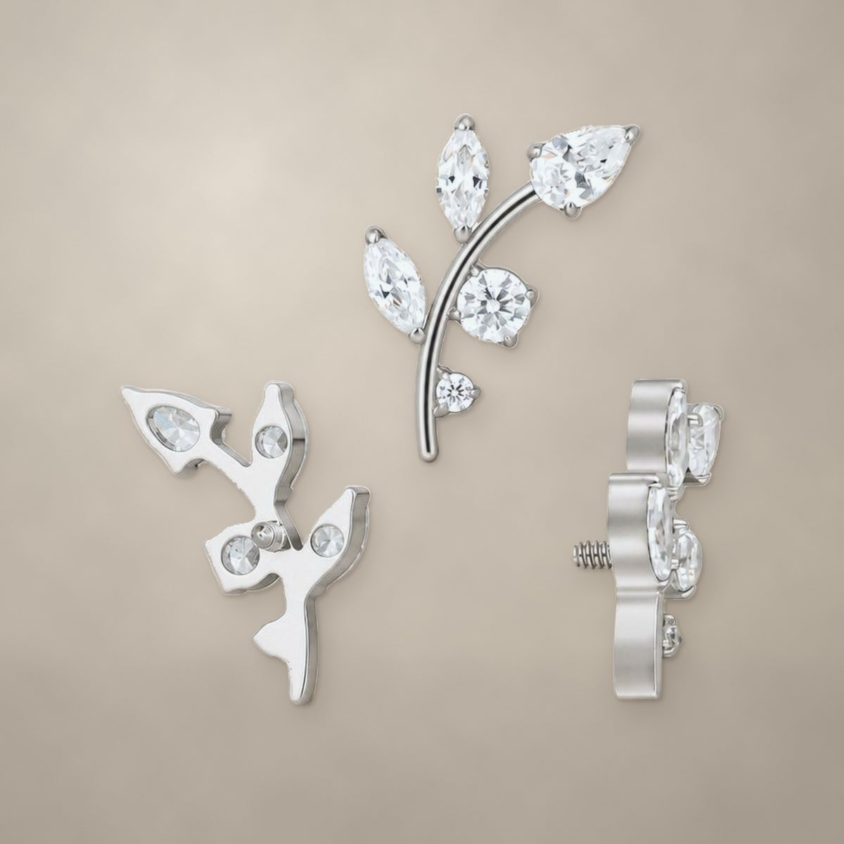 Leafy branch internally threaded end in titanium, shown from three angles