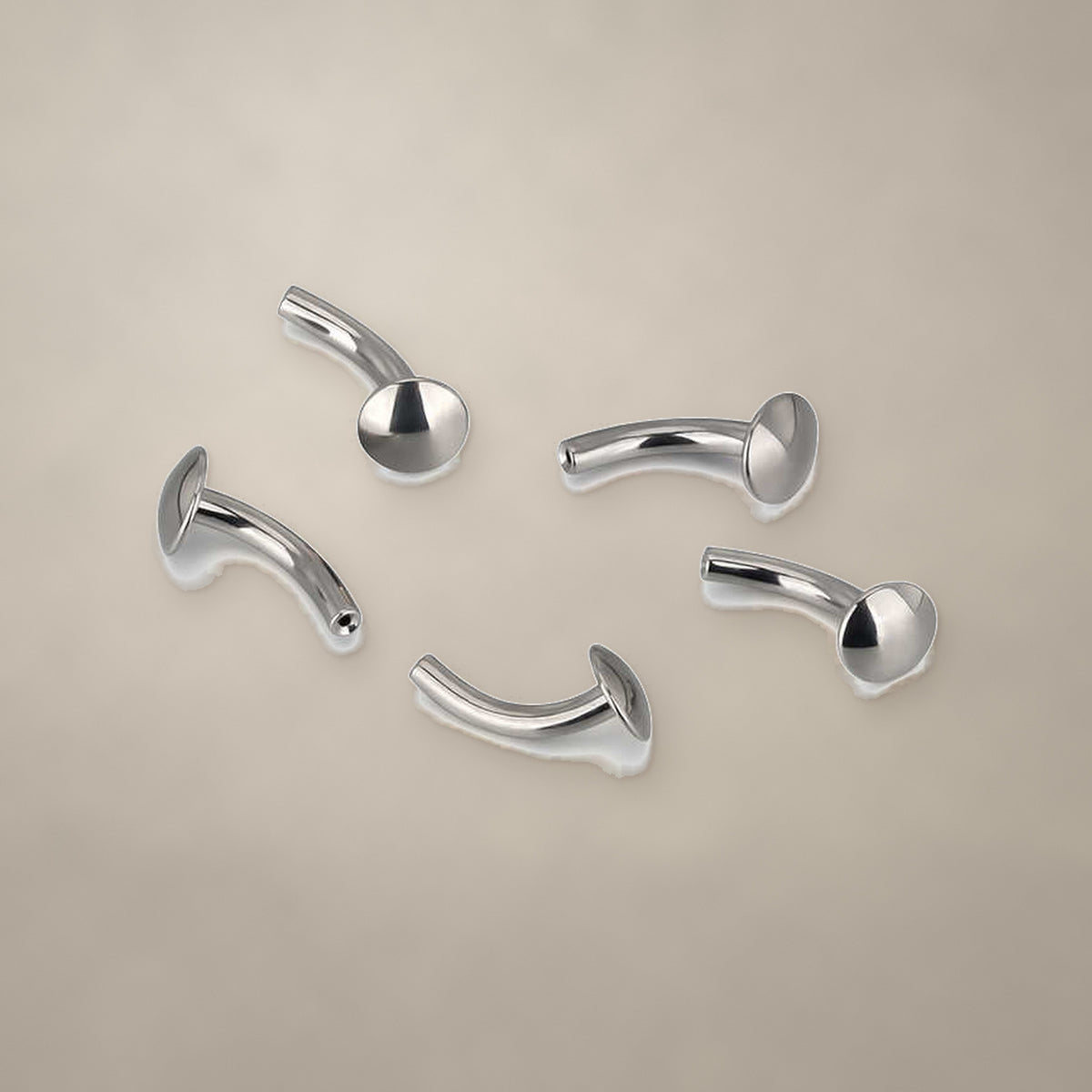 Flat-disc internally threaded curved barbell in titanium