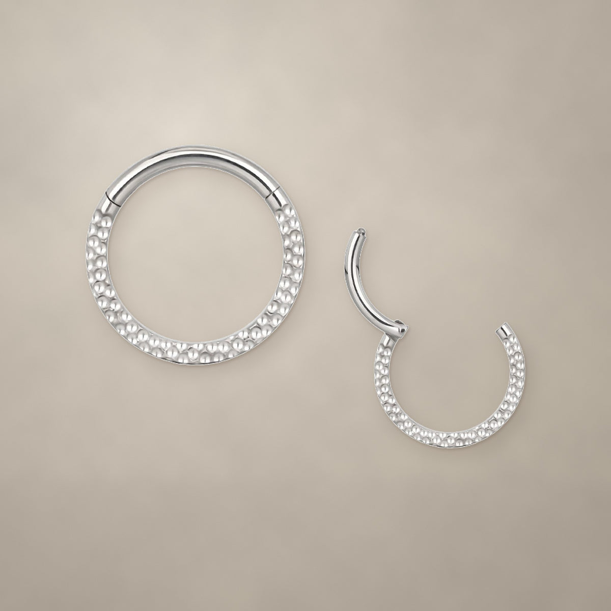 Textured titanium clicker ring (8 mm), shown closed and open
